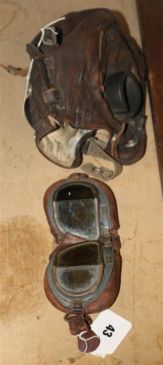 A vintage pilots goggles and cap